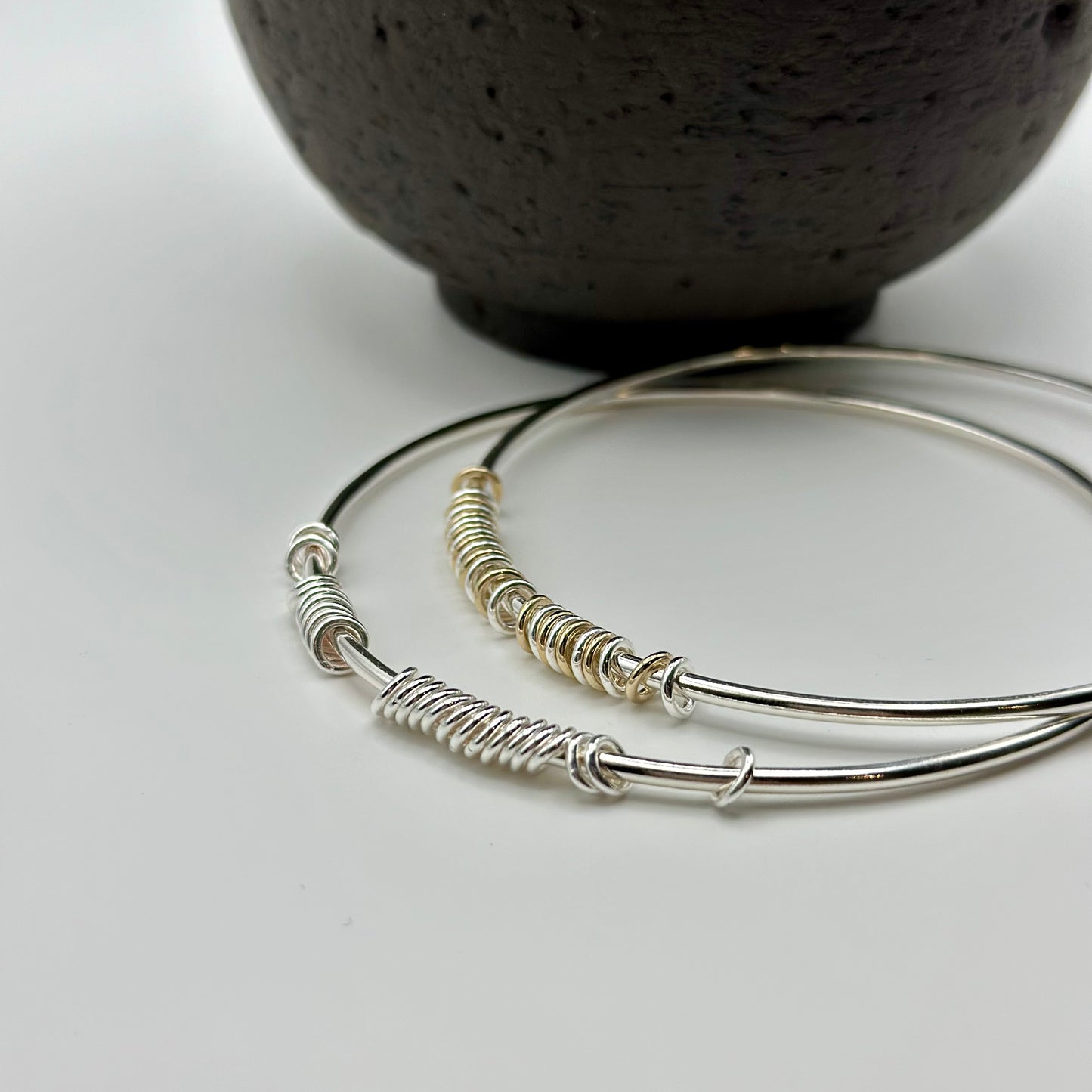 silver and gold anxiety relief bangles