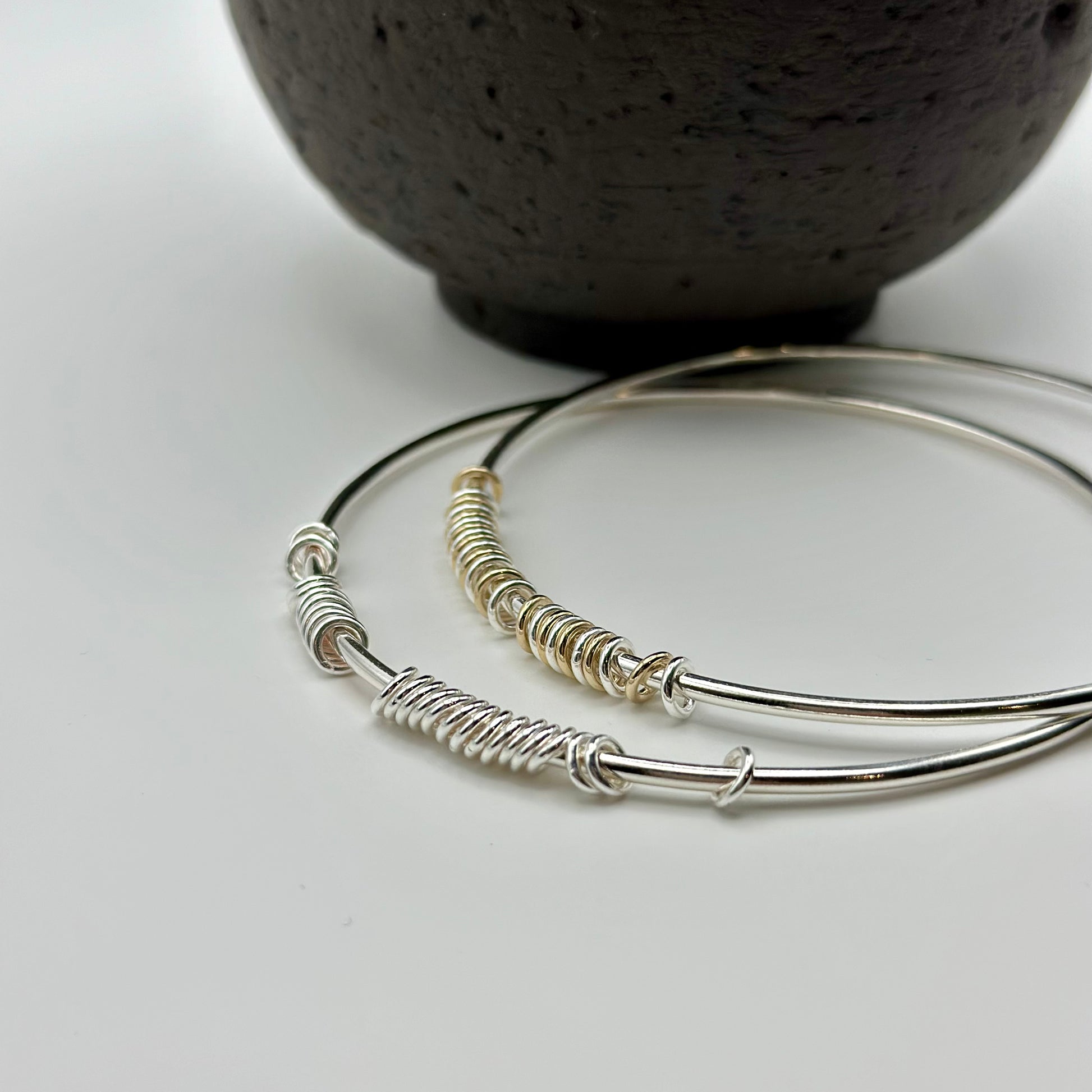 silver and gold anxiety relief bangles