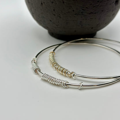 silver and gold anxiety relief bangles